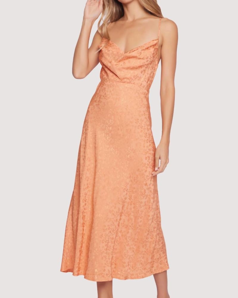 Front of a model wearing a size L Peach Midi Dress in Orange in Orange by LOST + WANDER. | dia_product_style_image_id:334919